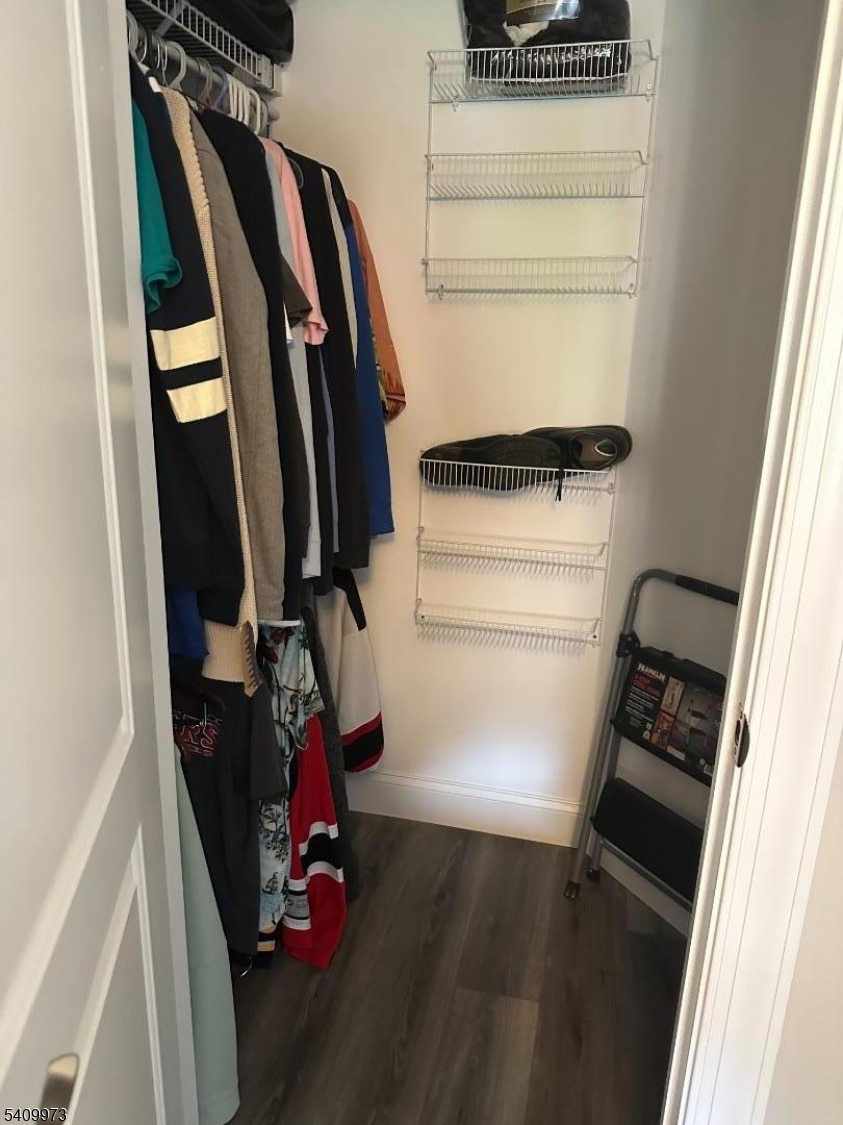 88 Boulevard, Unit 207 Passaic, NJ 07055 - Photo 9 of 13 a view of walk in closet with clothes and shoes