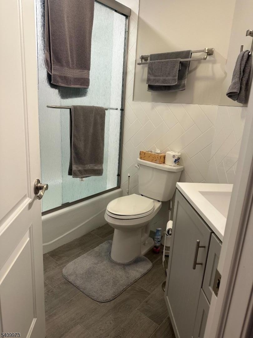 88 Boulevard, Unit 207 Passaic, NJ 07055 - Photo 10 of 13 a bathroom with a toilet and a sink