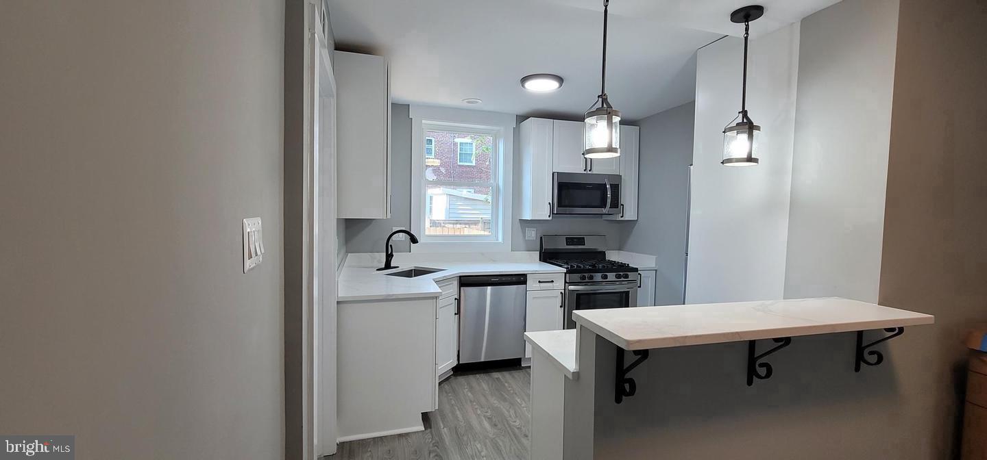 138 Dale Street Alexandria, VA 22305 - Photo 26 of 44 a kitchen with stainless steel appliances a sink stove and refrigerator
