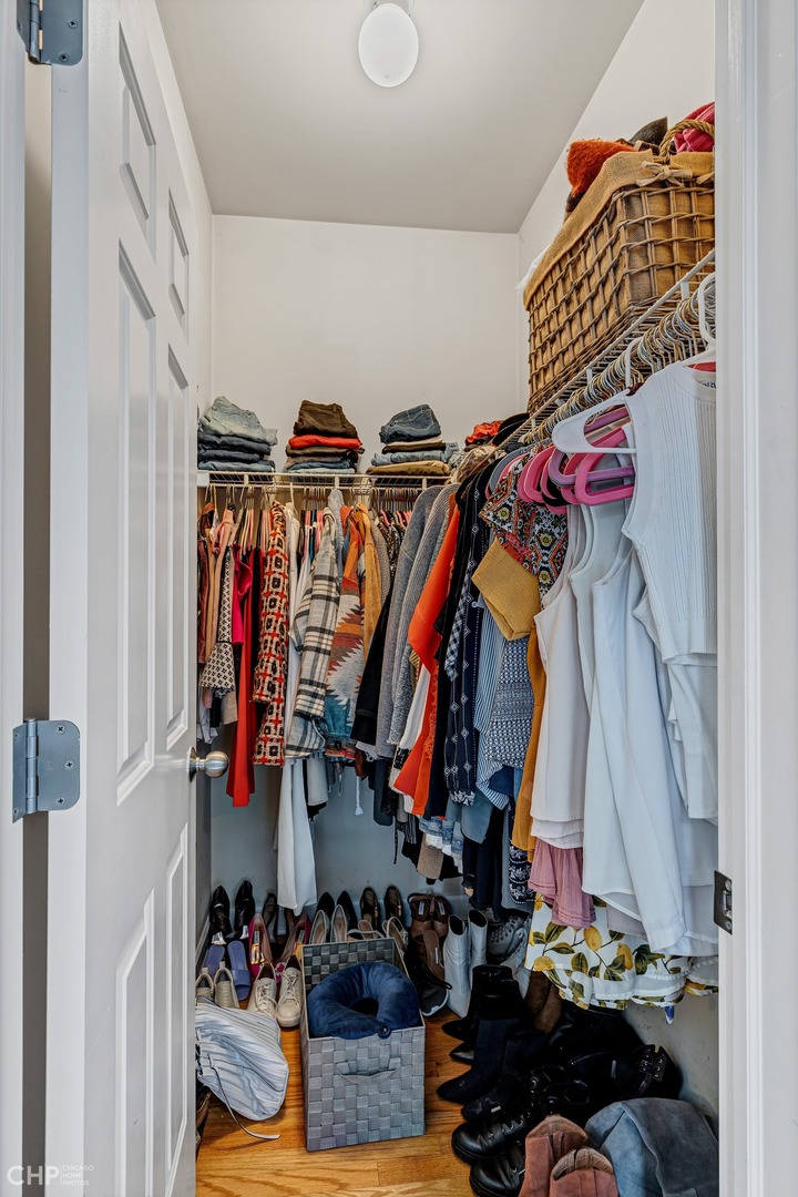 1645 West Addison Street, Unit 2 Chicago, IL 60613 - Photo 11 of 19 a view of walk in closet with clothes