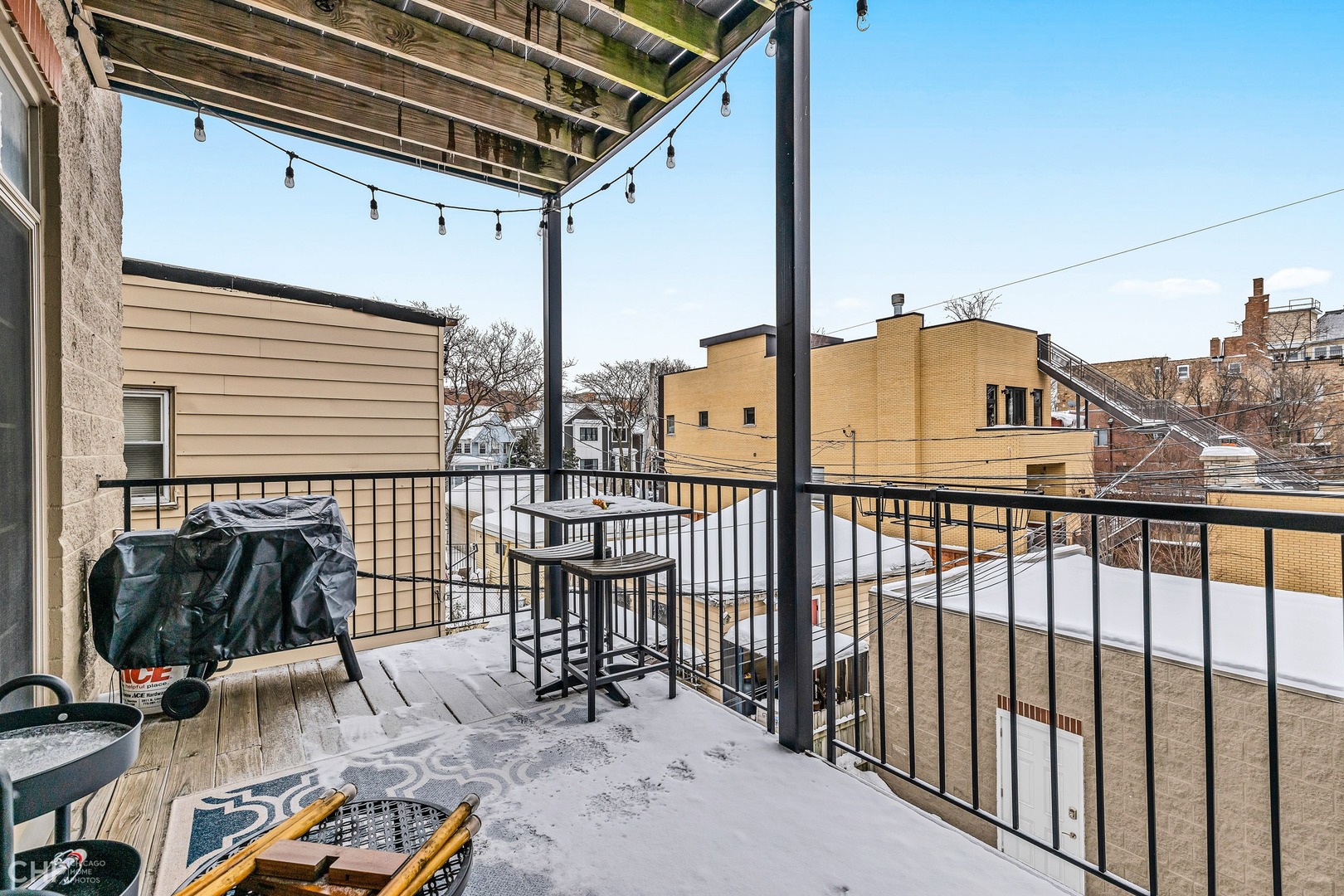 1645 West Addison Street, Unit 2 Chicago, IL 60613 - Photo 18 of 19 a view of a balcony with furniture
