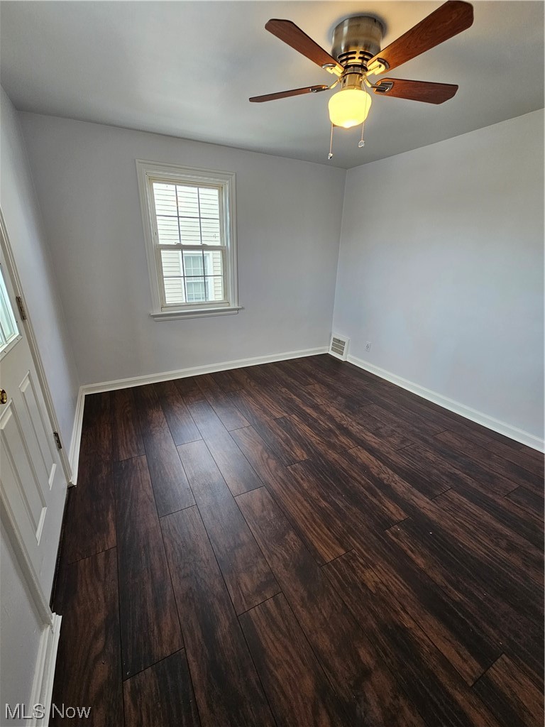 3688 Rolliston Road Cleveland, OH 44120 - Photo 26 of 44 Empty room with ceiling fan and dark hardwood / wood-style flooring