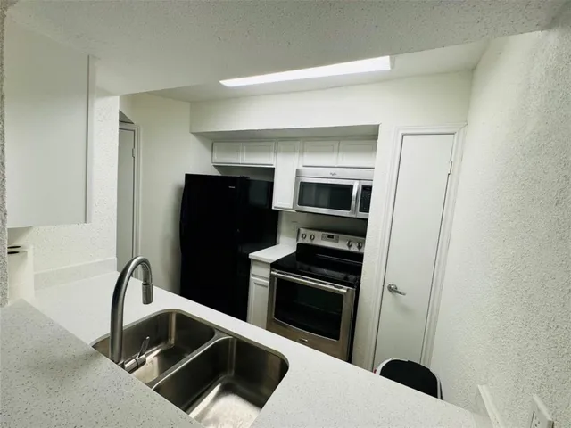 a bathroom with a sink toilet and vanity