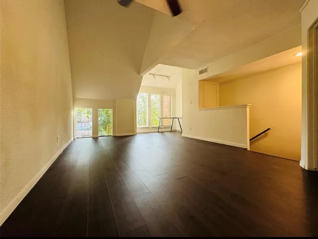 a view of a livingroom with wooden floor
