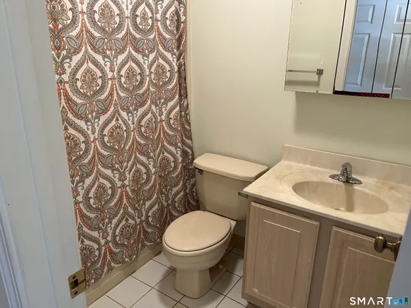 a bathroom with a toilet and a sink