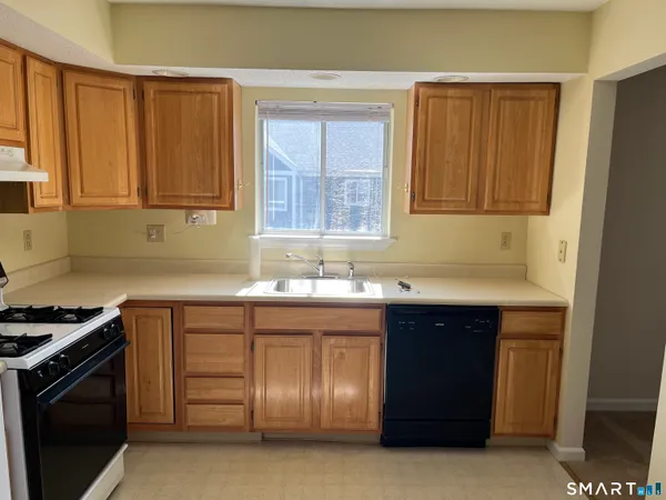 a kitchen with a sink and a stove