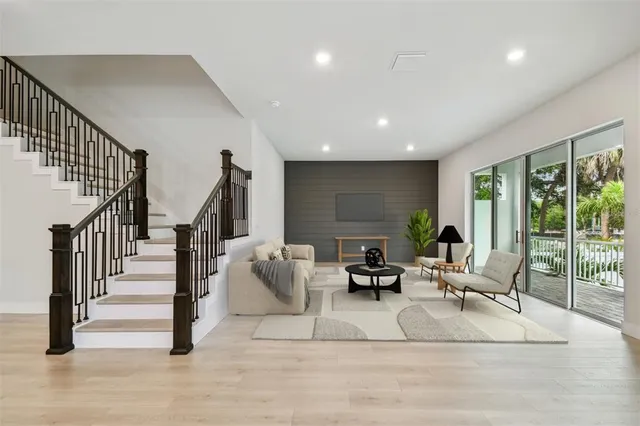 a spacious bedroom with a bed and a couch