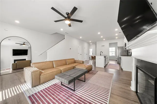 a living room with furniture and a fireplace