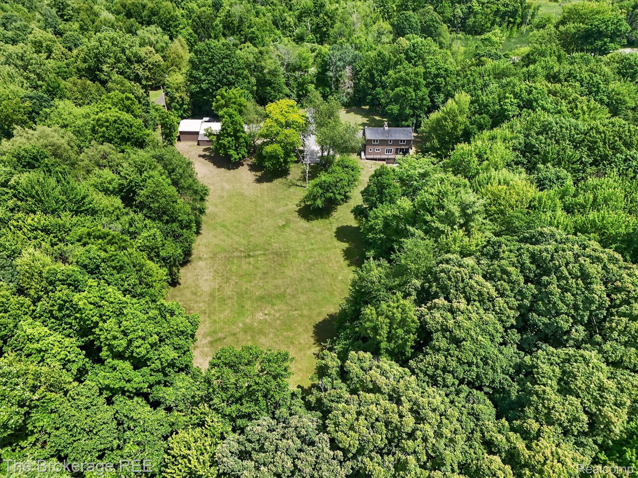 13269 North Genesee Road Clio, MI 48420 - Photo 58 of 67 Expansive wooded property featuring a cleared central lawn area