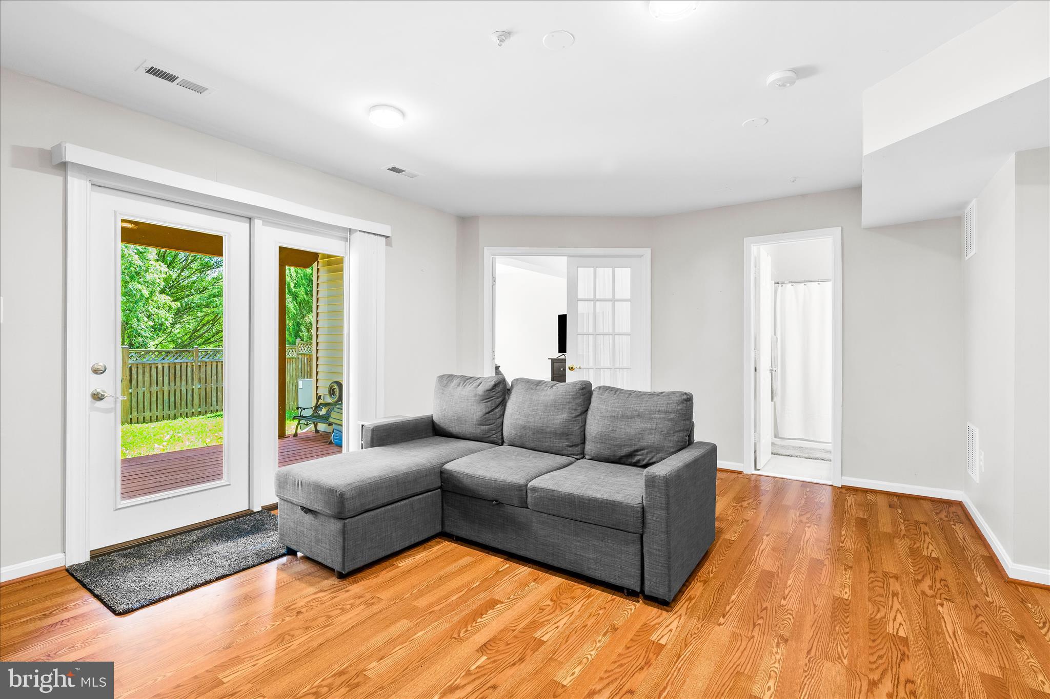 2442 Rippling Brook Road Frederick, MD 21701 - Photo 46 of 85 a living room with furniture and a large window