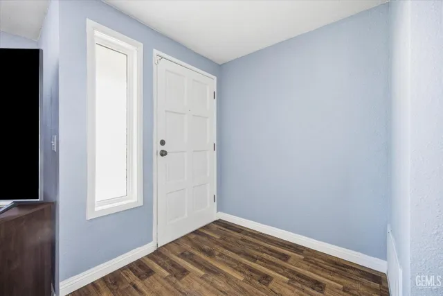 a view of a room with wooden floor and closet