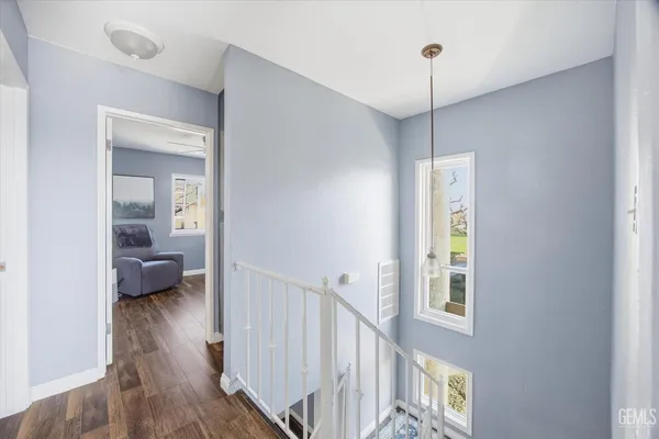 a view of a bedroom from a hallway