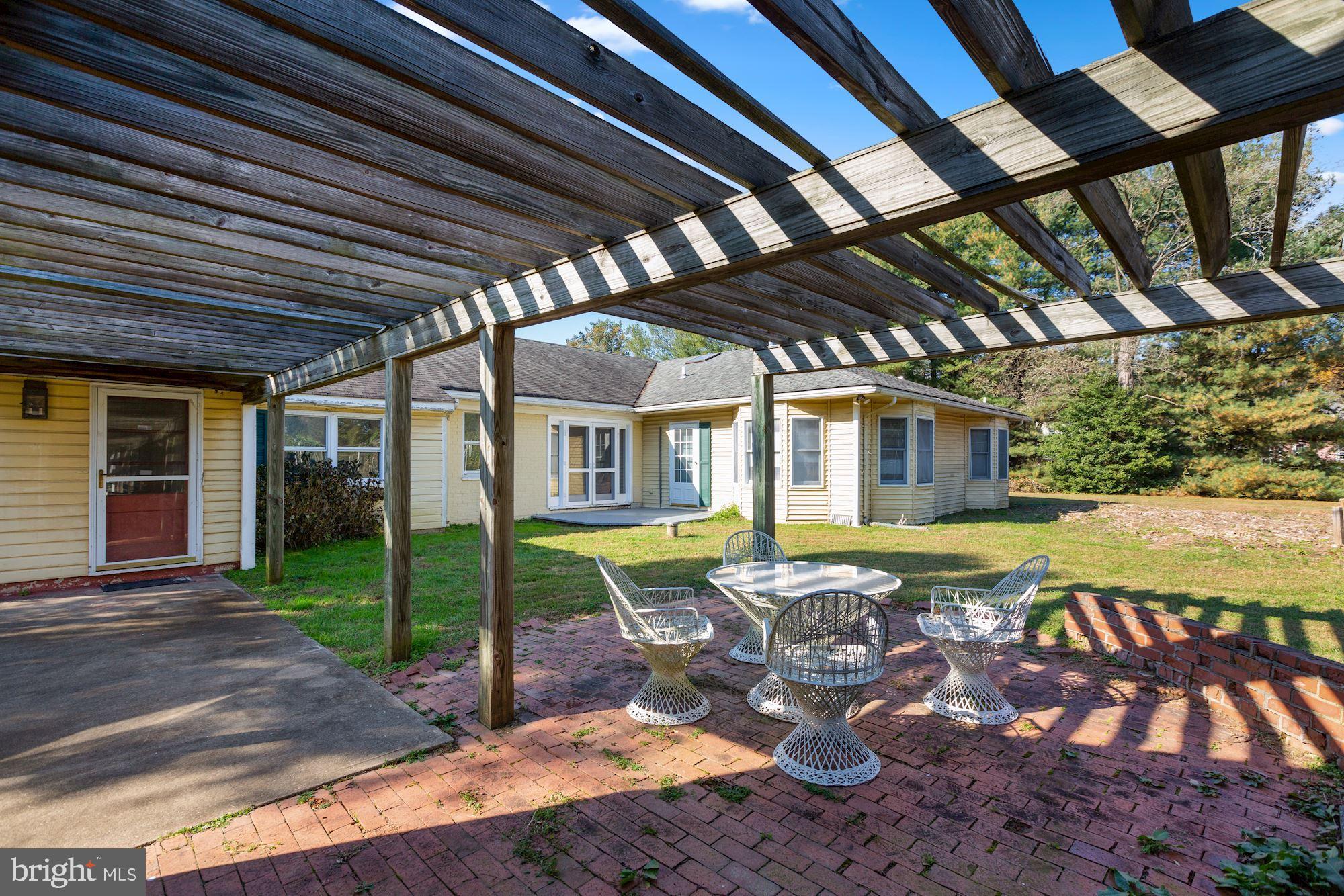 10809 South Glen Road Potomac, MD 20854 - Photo 22 of 27 Backyard Fireplace Entertaining Area