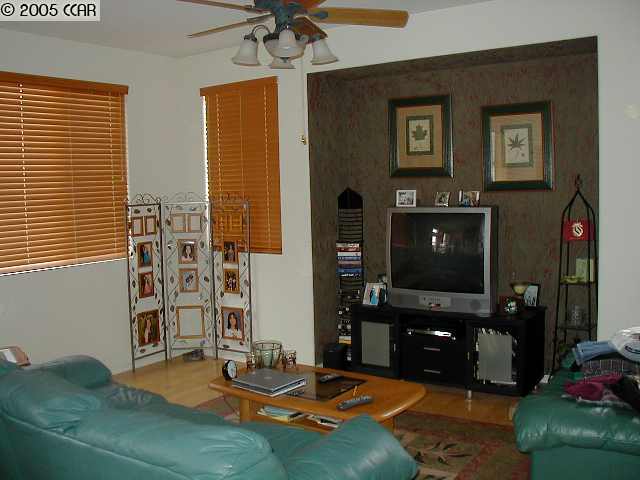 590 Anderson Rio Vista Rio Vista, CA 94571 - Photo 3 of 7 a living room with patio furniture and a fireplace