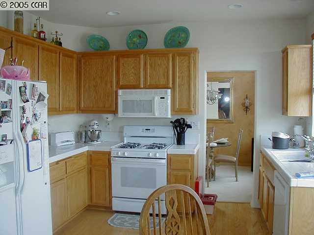 590 Anderson Rio Vista Rio Vista, CA 94571 - Photo 4 of 7 a kitchen with a sink a stove cabinets and utility room
