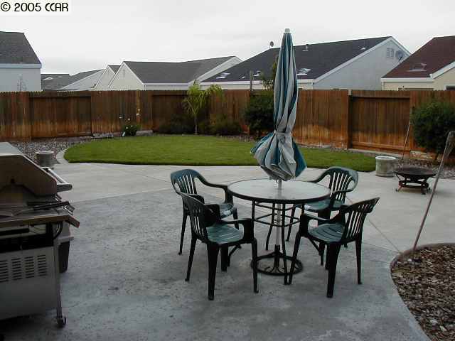590 Anderson Rio Vista Rio Vista, CA 94571 - Photo 6 of 7 a view of a patio with table and chairs a barbeque with wooden fence