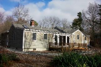 Undisclosed Address Centerville, MA 02632 - Photo 2 of 9 a view of a house with a yard