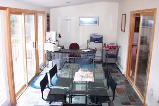 Undisclosed Address Centerville, MA 02632 - Photo 4 of 9 a living room with furniture and a large window