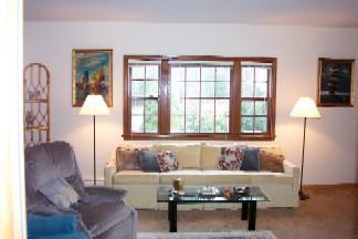 Undisclosed Address Centerville, MA 02632 - Photo 6 of 9 a living room with furniture and a window