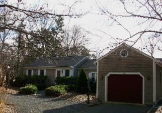 Undisclosed Address Centerville, MA 02632 - Photo 9 of 9 a front view of a house with garden