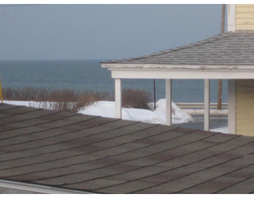 21 Reed Street Marshfield, MA 02020 - Photo 18 of 19 a bedroom with a bed and a large window