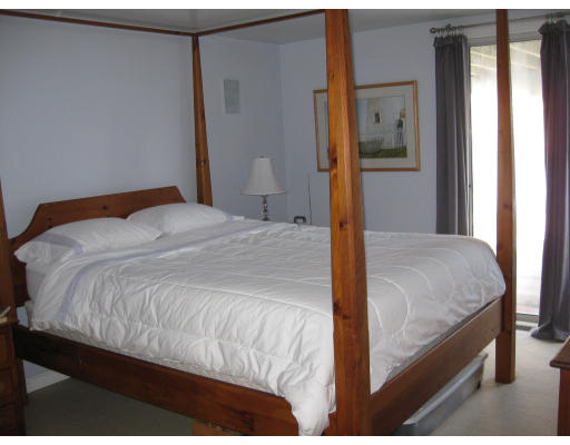 21 Reed Street Marshfield, MA 02020 - Photo 2 of 19 a bedroom with a bed and a table