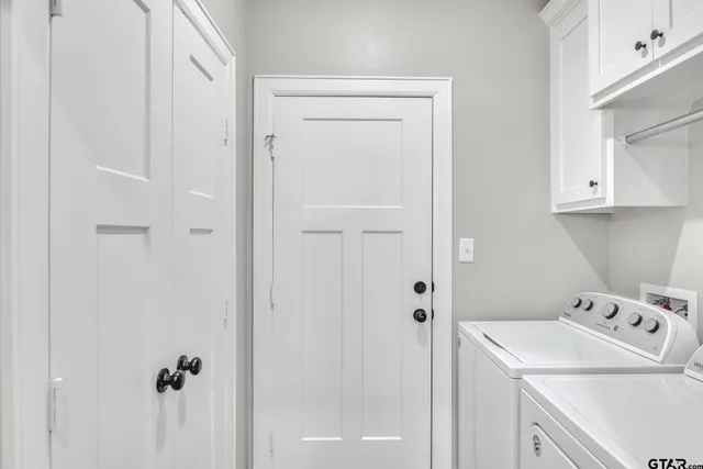 a bathroom with a sink vanity and a shower