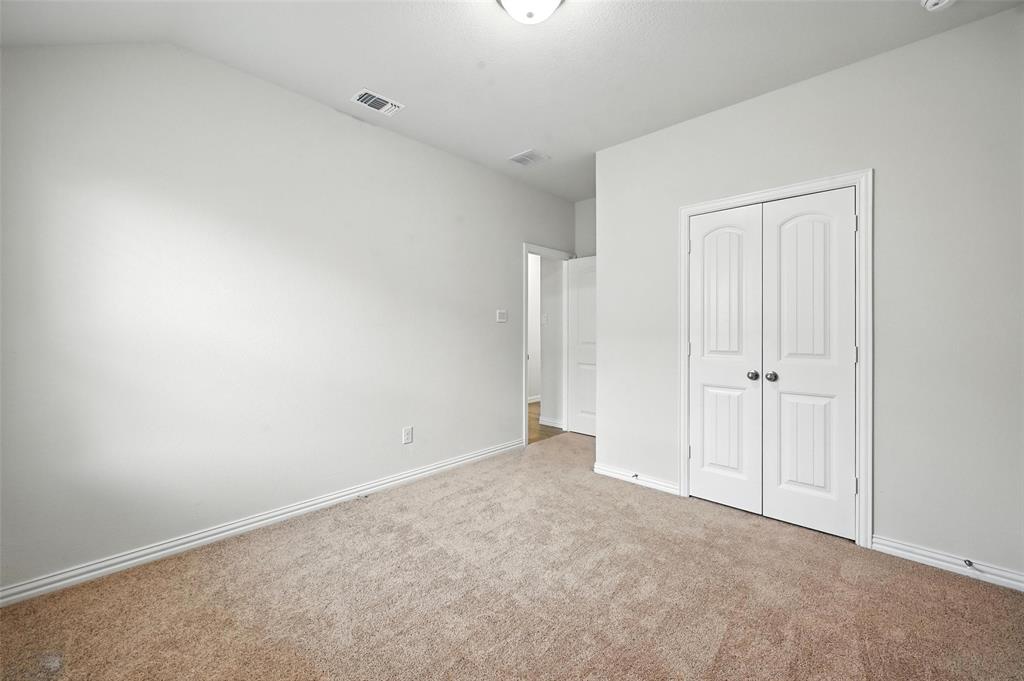 5 Pheasant Run Sanger, TX 76266 - Photo 15 of 27 Unfurnished bedroom featuring carpet flooring and a closet