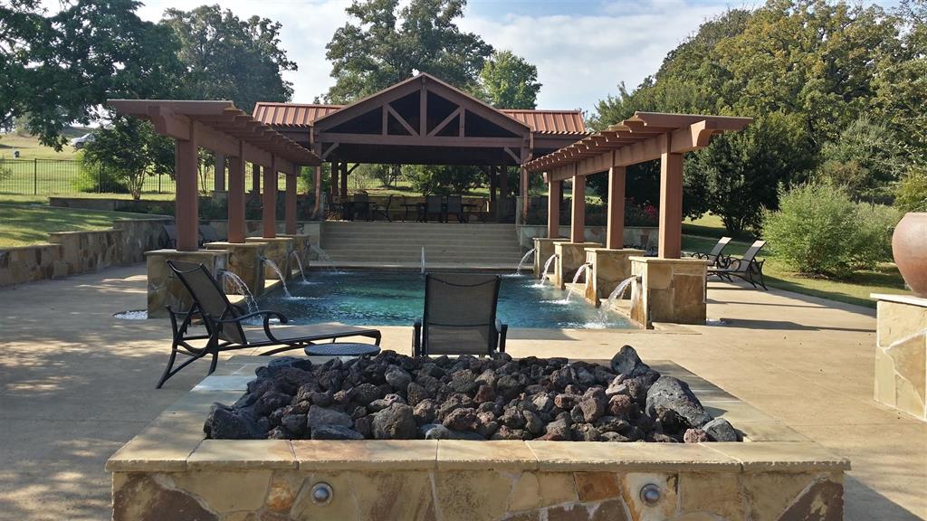 336 Grand View Drive Athens, TX 75752 - Photo 12 of 14 a view of a house with backyard sitting area and swimming pool