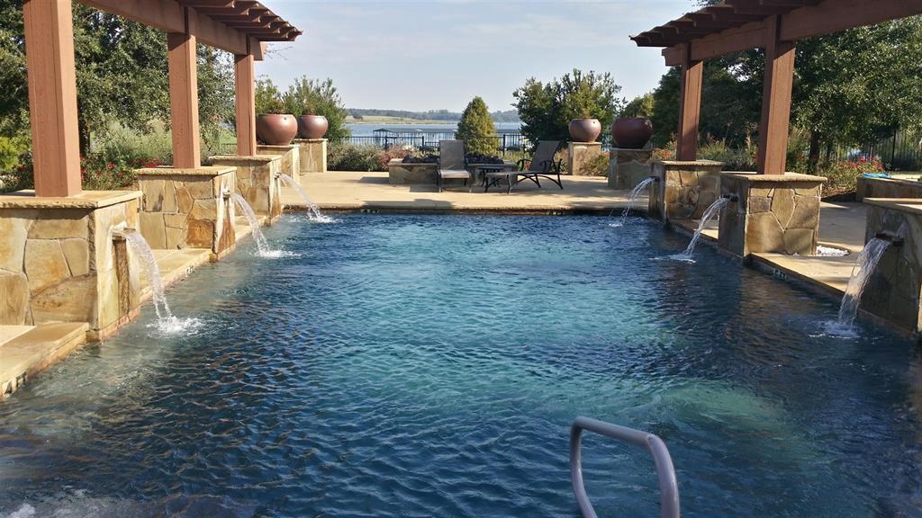 336 Grand View Drive Athens, TX 75752 - Photo 9 of 14 a view of a patio with table and chairs and potted plants
