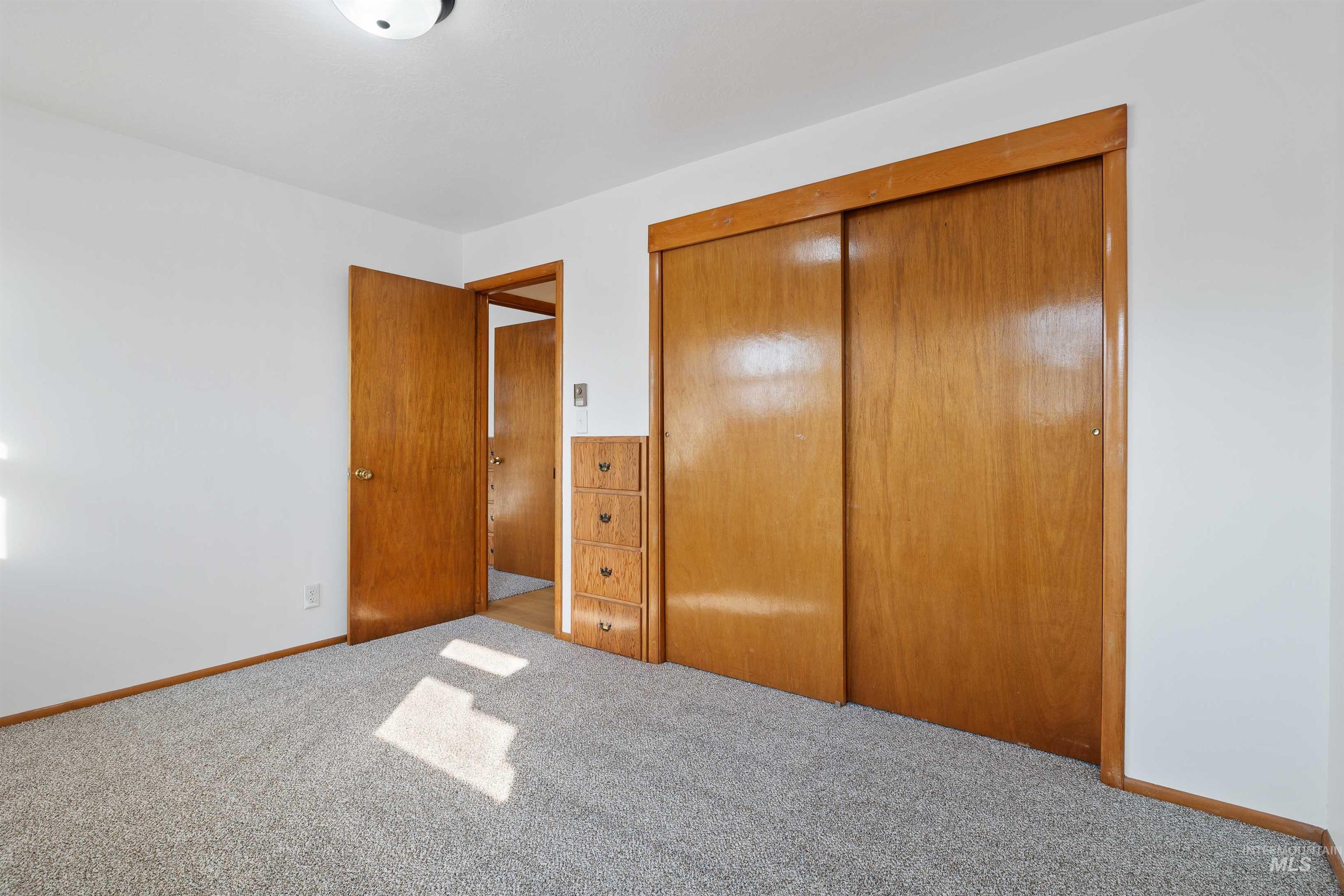 321 Clear Lakes Road Buhl, ID 83316 - Photo 15 of 34 White walls with wood-finish trim and doors