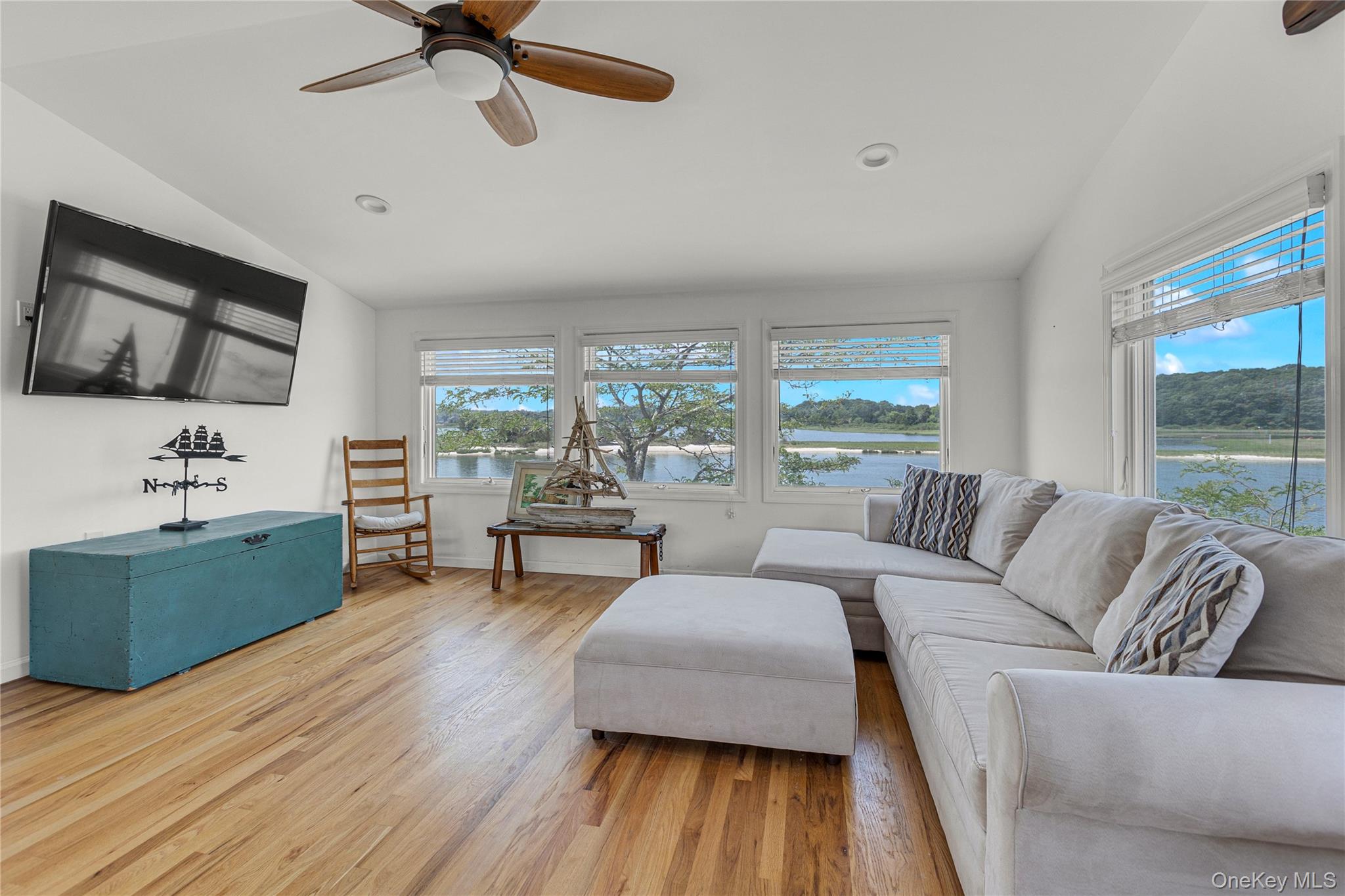 286 Towd Point Road Southampton, NY 11968 - Photo 11 of 35 a living room with furniture and a large window