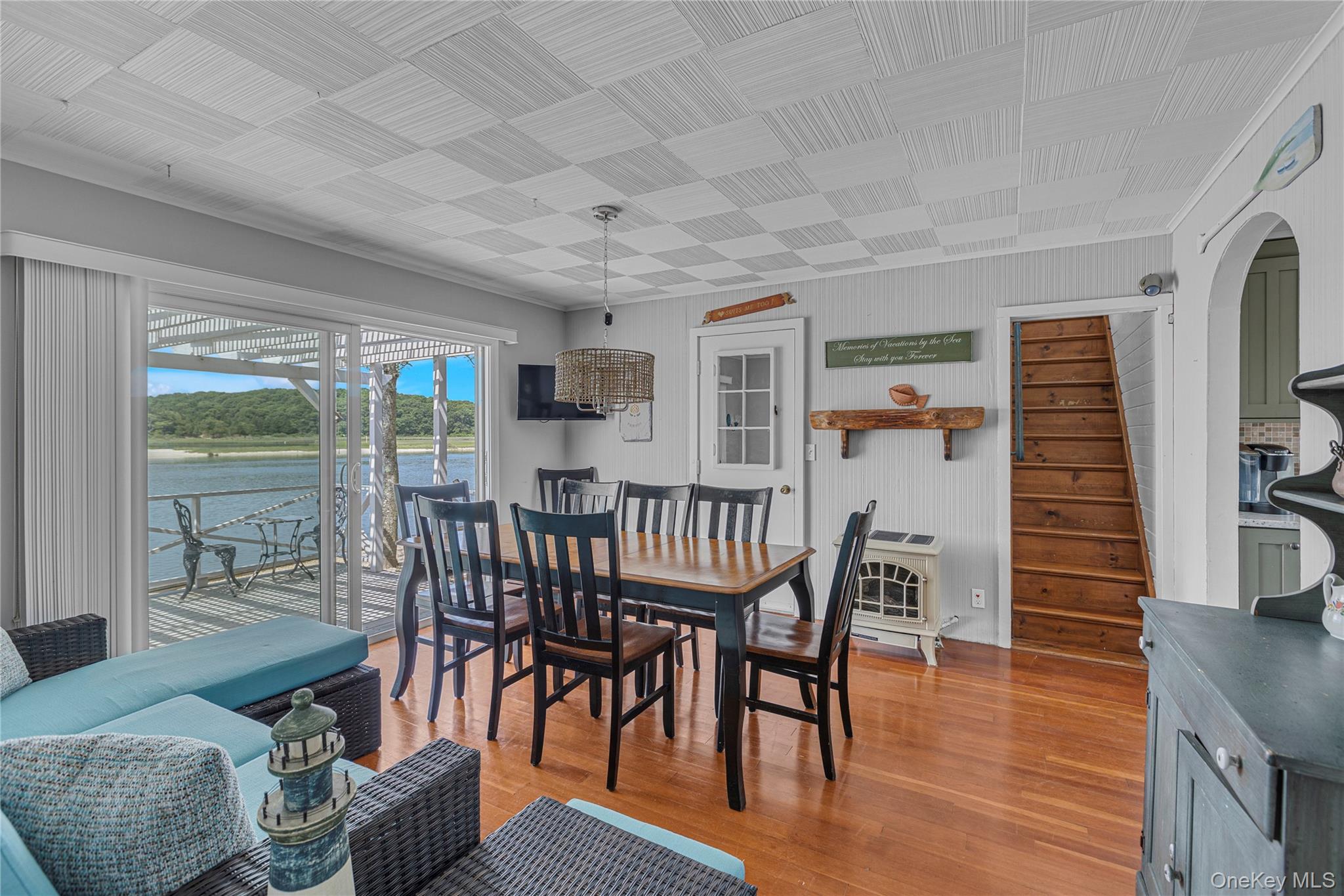 286 Towd Point Road Southampton, NY 11968 - Photo 15 of 35 a view of a dining room with furniture window and wooden floor