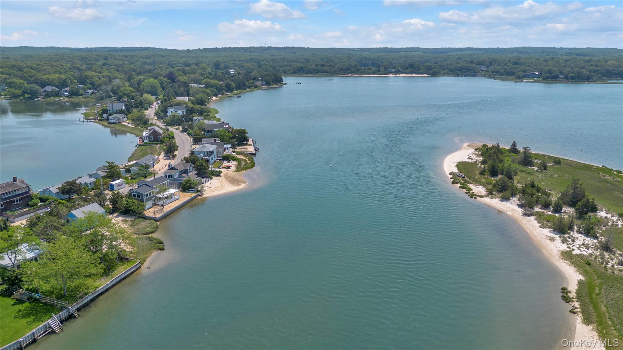286 Towd Point Road Southampton, NY 11968 - Photo 30 of 35 a view of a lake with a mountain in the background