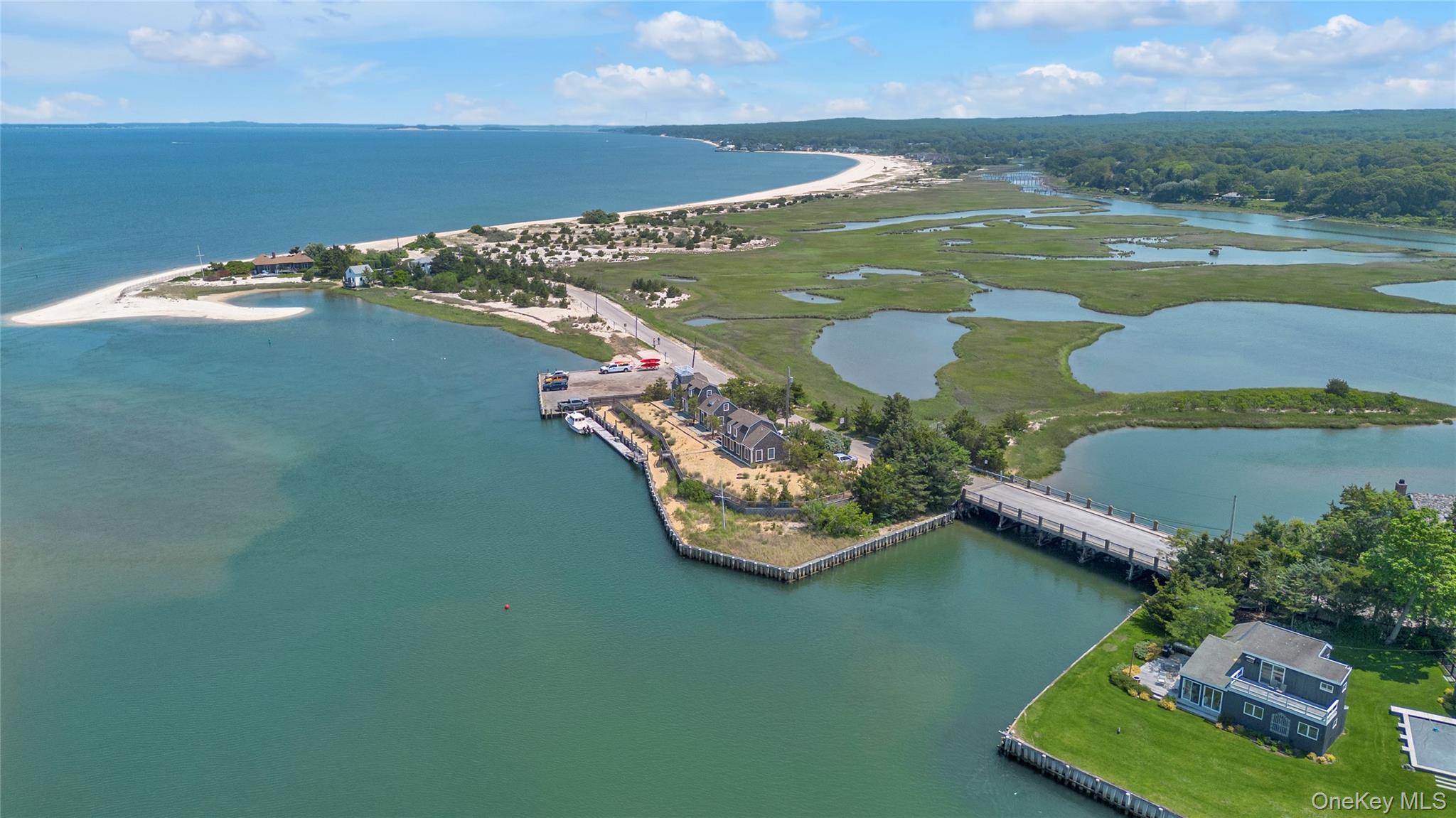 286 Towd Point Road Southampton, NY 11968 - Photo 9 of 35 an aerial view of a house with a yard lake and mountain view