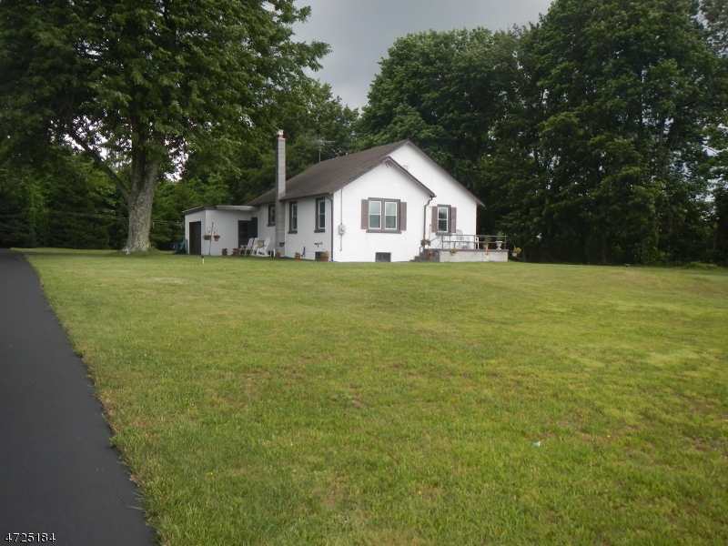 482 Highway 46 Hackettstown, NJ 07840 - Photo 1 of 16 a front door view of a house with a yard and trees