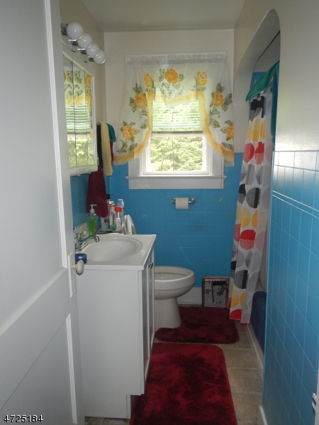 482 Highway 46 Hackettstown, NJ 07840 - Photo 11 of 16 a bathroom with a toilet sink and mirror