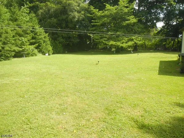 a view of a lake with a yard