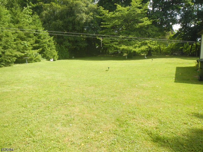 482 Highway 46 Hackettstown, NJ 07840 - Photo 14 of 16 a view of a lake with a yard