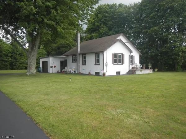 a house with trees in the background