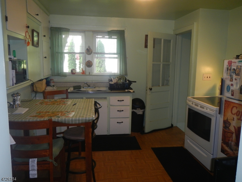 482 Highway 46 Hackettstown, NJ 07840 - Photo 4 of 16 a kitchen with stainless steel appliances granite countertop a stove a sink and a refrigerator