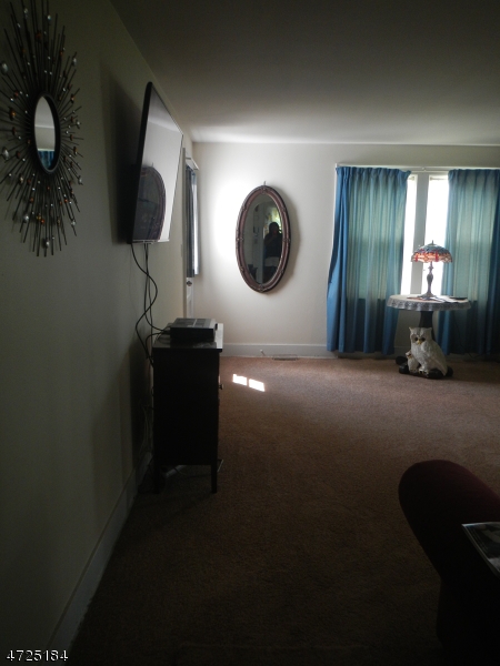 482 Highway 46 Hackettstown, NJ 07840 - Photo 7 of 16 a bedroom with a bed and a mirror