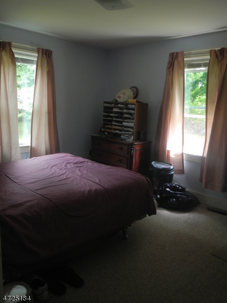 482 Highway 46 Hackettstown, NJ 07840 - Photo 9 of 16 a bedroom with a bed and a window