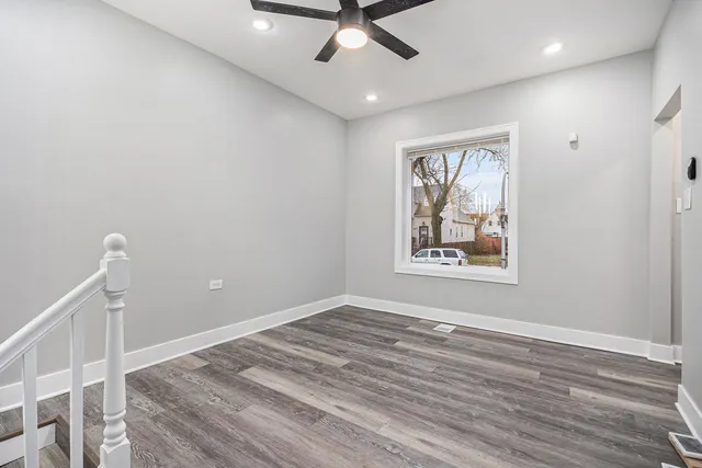 a view of room with wooden floor and window