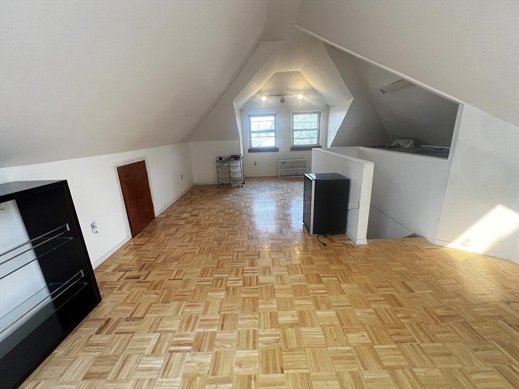 103 St Andrew Road, Unit 2 Boston, MA 02128 - Photo 16 of 20 a view of an empty room with a fireplace and a window