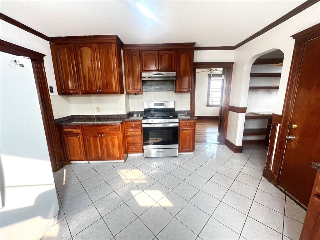 103 St Andrew Road, Unit 2 Boston, MA 02128 - Photo 2 of 20 a kitchen with stainless steel appliances a stove a sink and a microwave