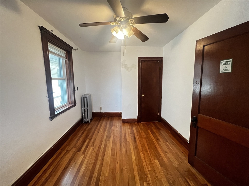 103 St Andrew Road, Unit 2 Boston, MA 02128 - Photo 9 of 20 wooden floor in an empty room with a window