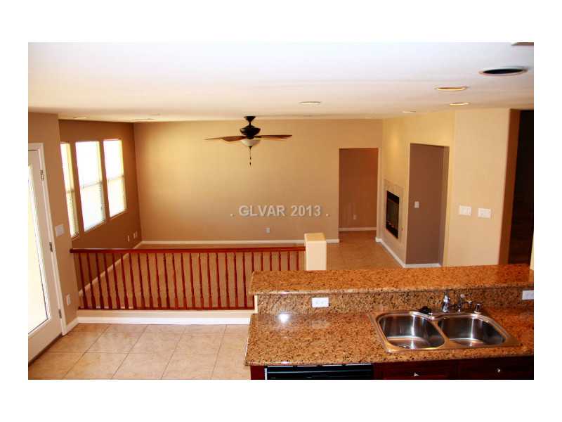 656 Doubleshot Lane Henderson, NV 89052 - Photo 15 of 35 Kitchen. Kitchen opens to spacious living room!