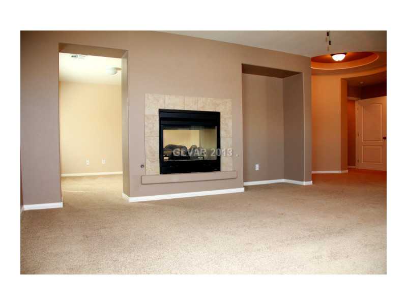 656 Doubleshot Lane Henderson, NV 89052 - Photo 24 of 35 Master Bedroom. 2 way fireplace with large retreat from master bedroom
