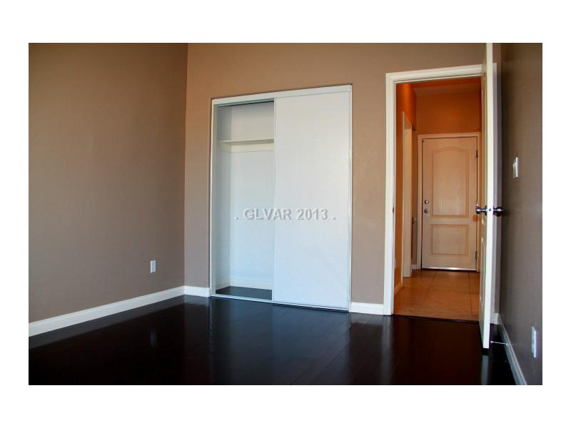 656 Doubleshot Lane Henderson, NV 89052 - Photo 33 of 35 Guest Bedroom. located downstairs, laminate flooring.